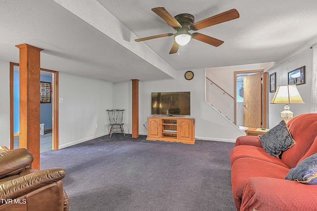 carpeted living room featuring a textured ceiling and ceiling fan