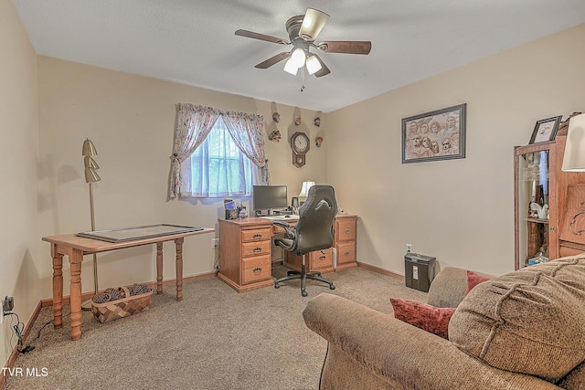 carpeted home office with ceiling fan