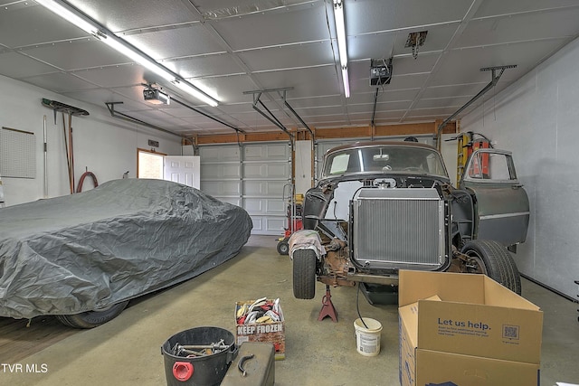 garage featuring a garage door opener