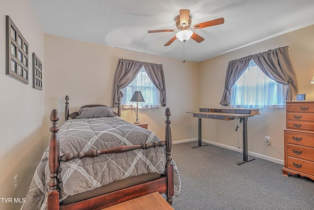 bedroom with carpet flooring, a textured ceiling, and ceiling fan