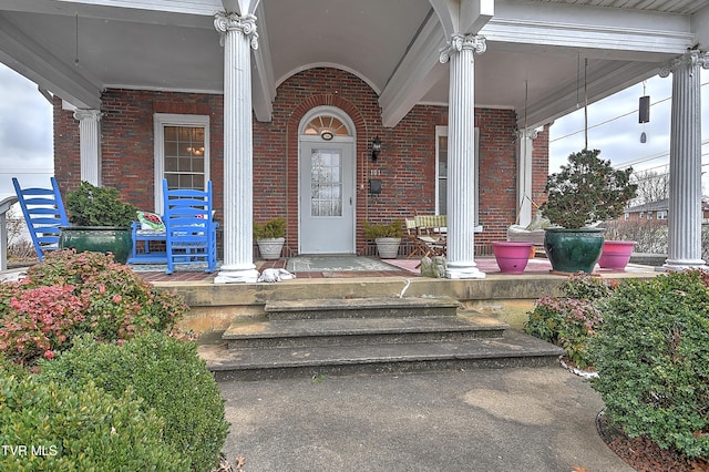 doorway to property featuring covered porch