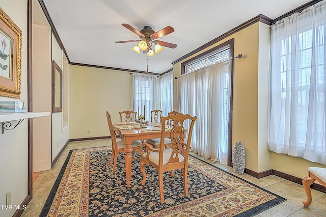 dining room with crown molding, plenty of natural light, light tile patterned flooring, and ceiling fan