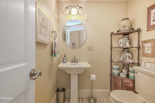 bathroom with sink and toilet