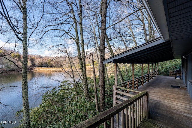 wooden deck featuring a water view