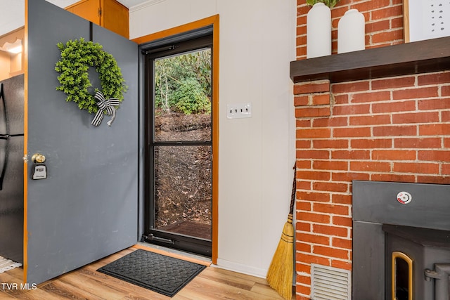 doorway to outside with light hardwood / wood-style floors