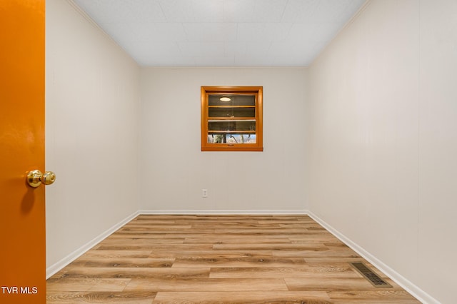 unfurnished room with light hardwood / wood-style floors