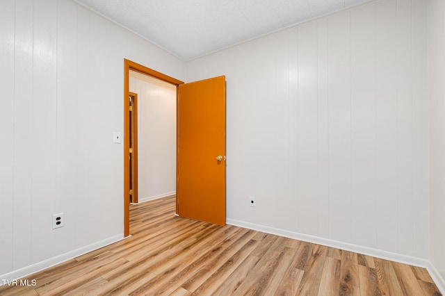 unfurnished room featuring light hardwood / wood-style flooring