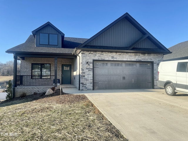 view of front of house featuring a porch and a garage