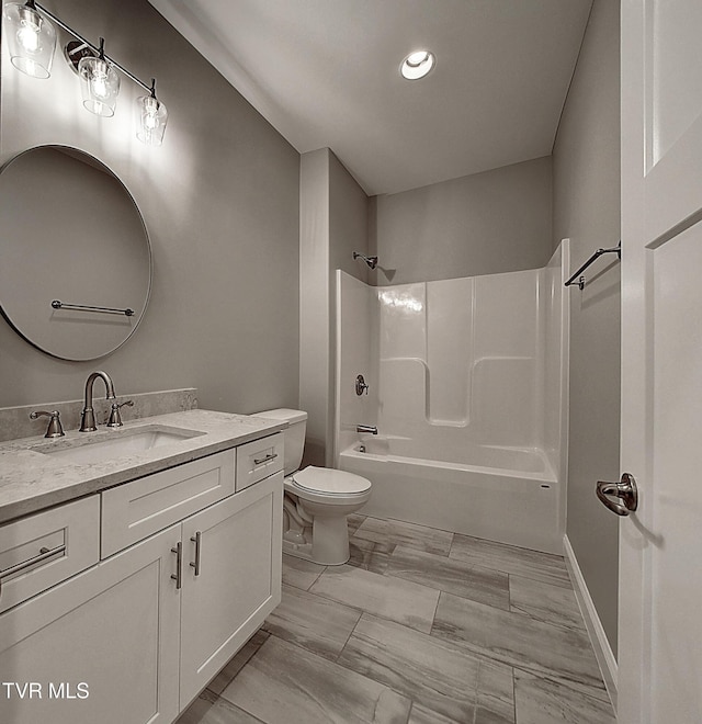 full bathroom with  shower combination, toilet, and vanity