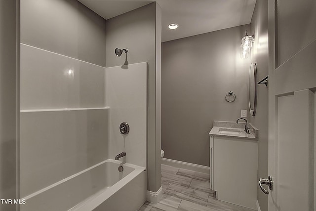 full bathroom featuring shower / tub combination, vanity, and toilet