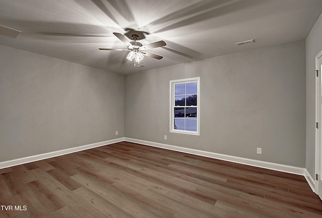 spare room with light hardwood / wood-style flooring and ceiling fan