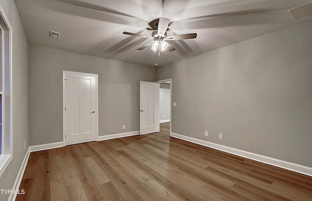 unfurnished bedroom featuring ceiling fan and light wood-type flooring