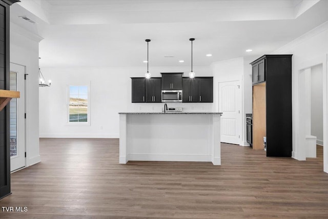 kitchen with decorative light fixtures, light stone countertops, dark wood-type flooring, and an inviting chandelier