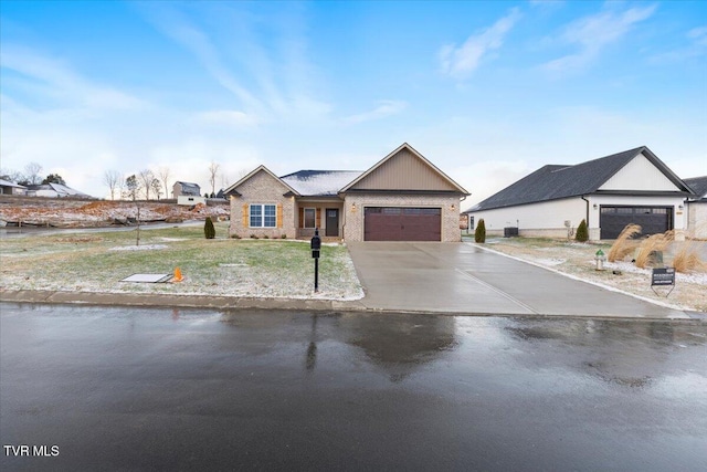 view of front of home featuring a garage and a front lawn