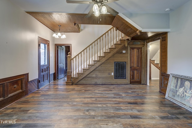 entrance foyer featuring ceiling fan with notable chandelier, wooden ceiling, and dark wood-type flooring