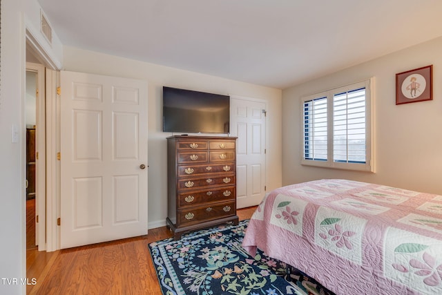 bedroom with light hardwood / wood-style floors