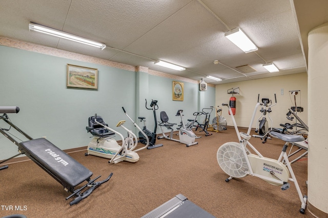 gym with a textured ceiling