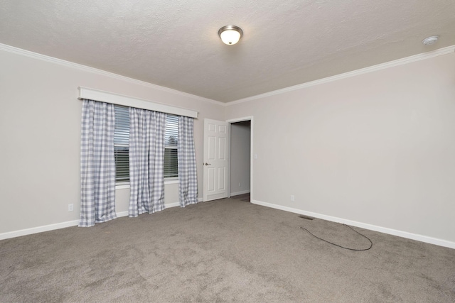 carpeted empty room featuring a textured ceiling and crown molding