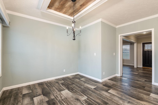 unfurnished dining area with ornamental molding, a textured ceiling, an inviting chandelier, and dark wood-type flooring