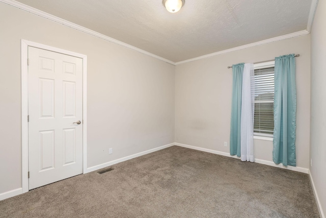 spare room with carpet and crown molding