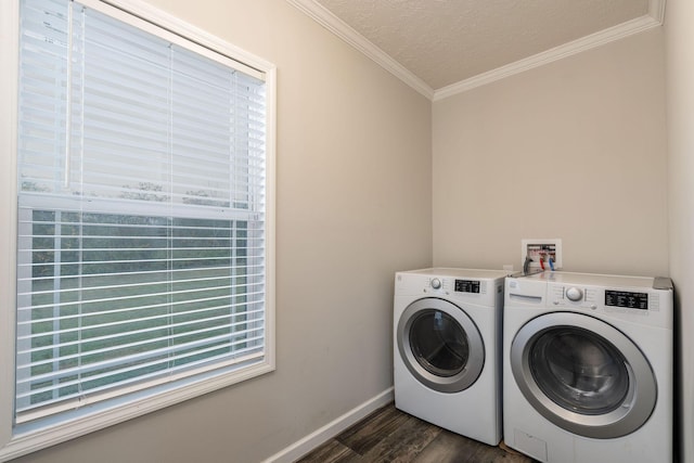 laundry area featuring washer and dryer, ornamental molding, a textured ceiling, and dark wood-type flooring