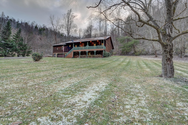 exterior space with a front lawn and a deck