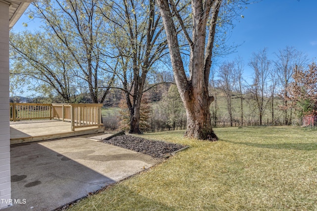 view of yard with a wooden deck