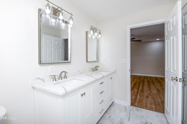 bathroom featuring ceiling fan and vanity