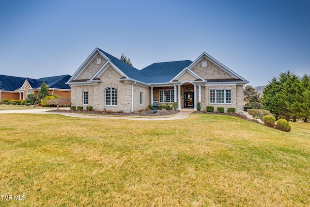 craftsman-style home with a front yard