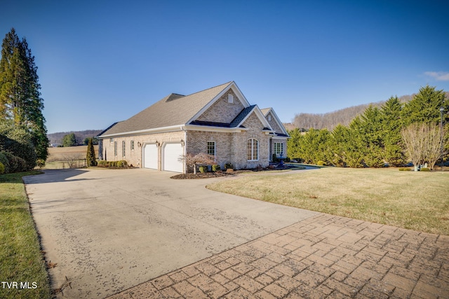 view of home's exterior with a garage and a yard