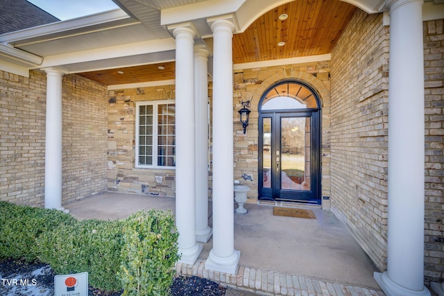 doorway to property featuring covered porch