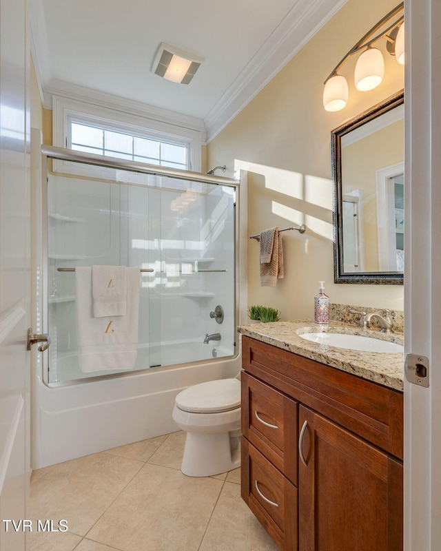 full bathroom featuring enclosed tub / shower combo, tile patterned floors, toilet, vanity, and ornamental molding