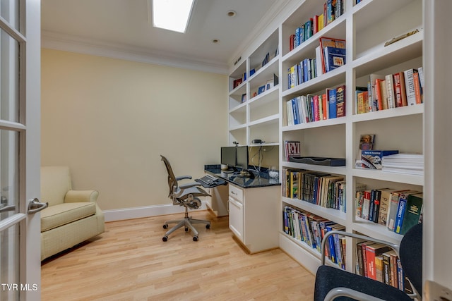 office space featuring light hardwood / wood-style flooring and ornamental molding