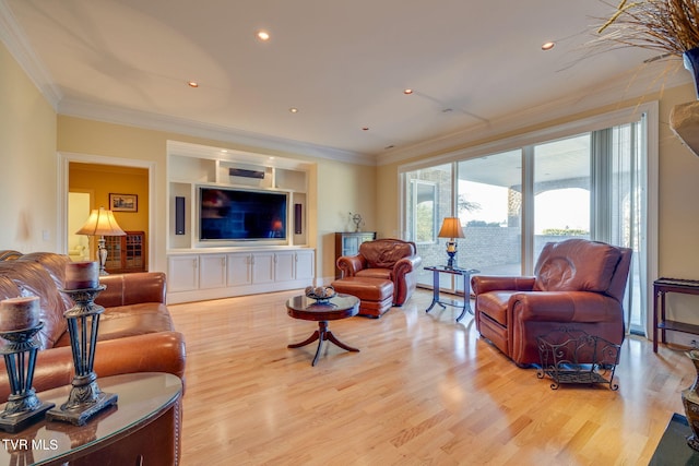 living room with hardwood / wood-style flooring and crown molding