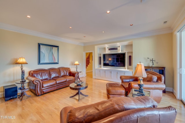 living room featuring crown molding and light wood-type flooring