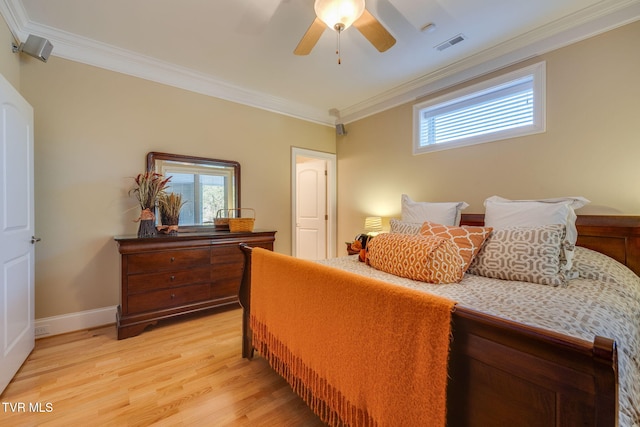 bedroom featuring ceiling fan, crown molding, and light hardwood / wood-style flooring