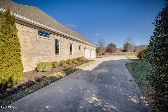 view of side of home with a garage