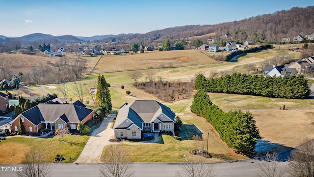 birds eye view of property featuring a mountain view