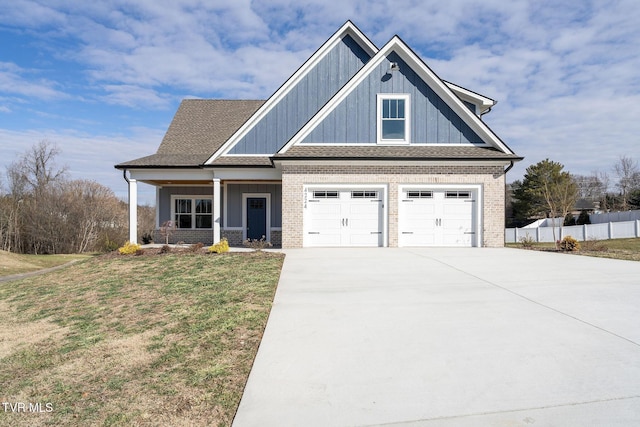 craftsman-style house with a front lawn, a porch, and a garage