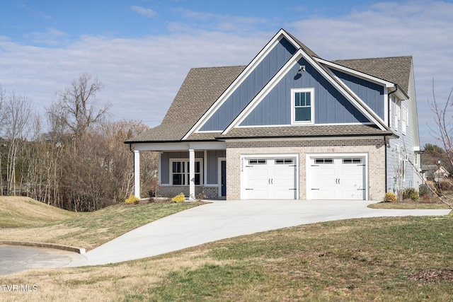 view of front facade featuring a front yard and a garage