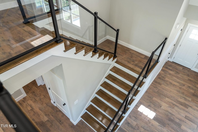 stairway with wood-type flooring