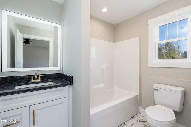 full bathroom featuring toilet, bathtub / shower combination, ceiling fan, and vanity