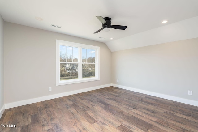 unfurnished room with lofted ceiling, ceiling fan, and dark hardwood / wood-style floors