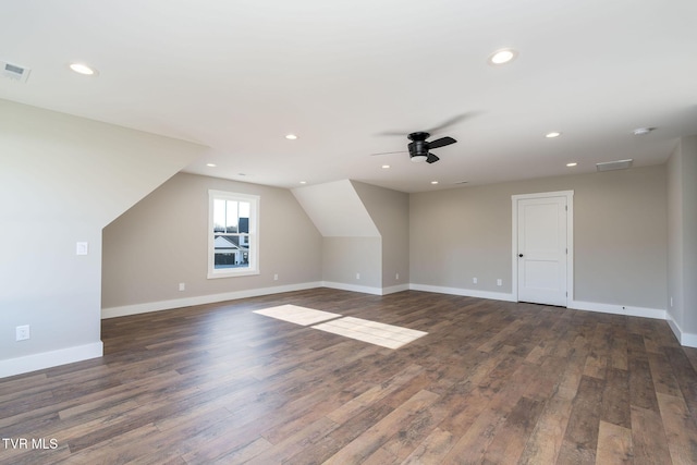 additional living space featuring lofted ceiling, ceiling fan, and dark hardwood / wood-style floors