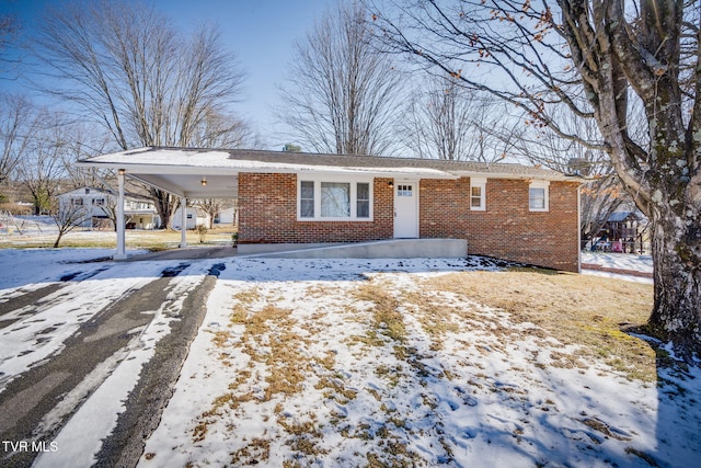 ranch-style home with a carport