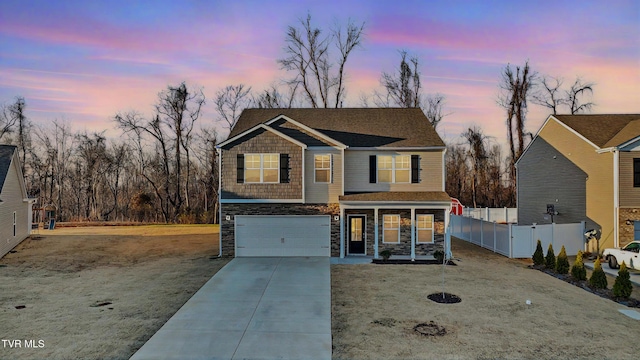 view of front of property featuring a yard and a garage