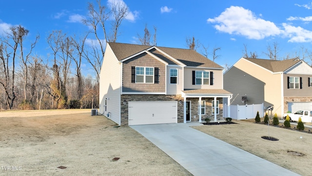 view of front of home with a garage and central AC unit