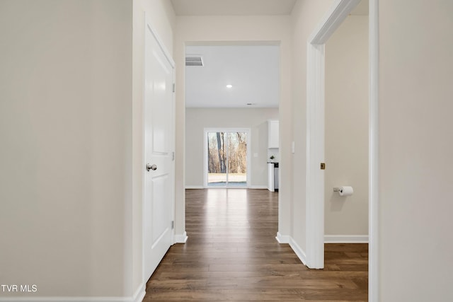 hallway featuring dark hardwood / wood-style floors