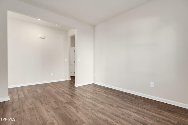 unfurnished room featuring hardwood / wood-style flooring