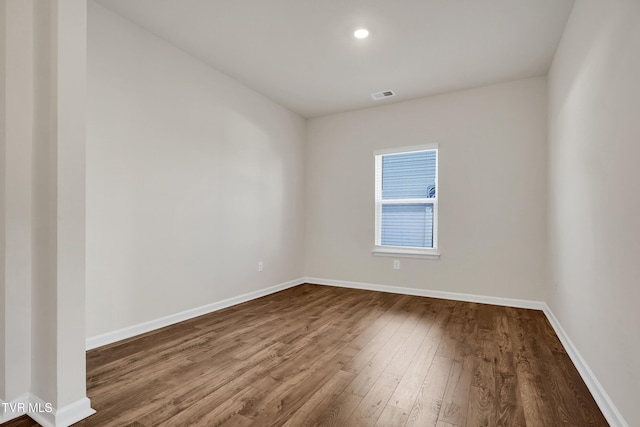 spare room featuring hardwood / wood-style floors